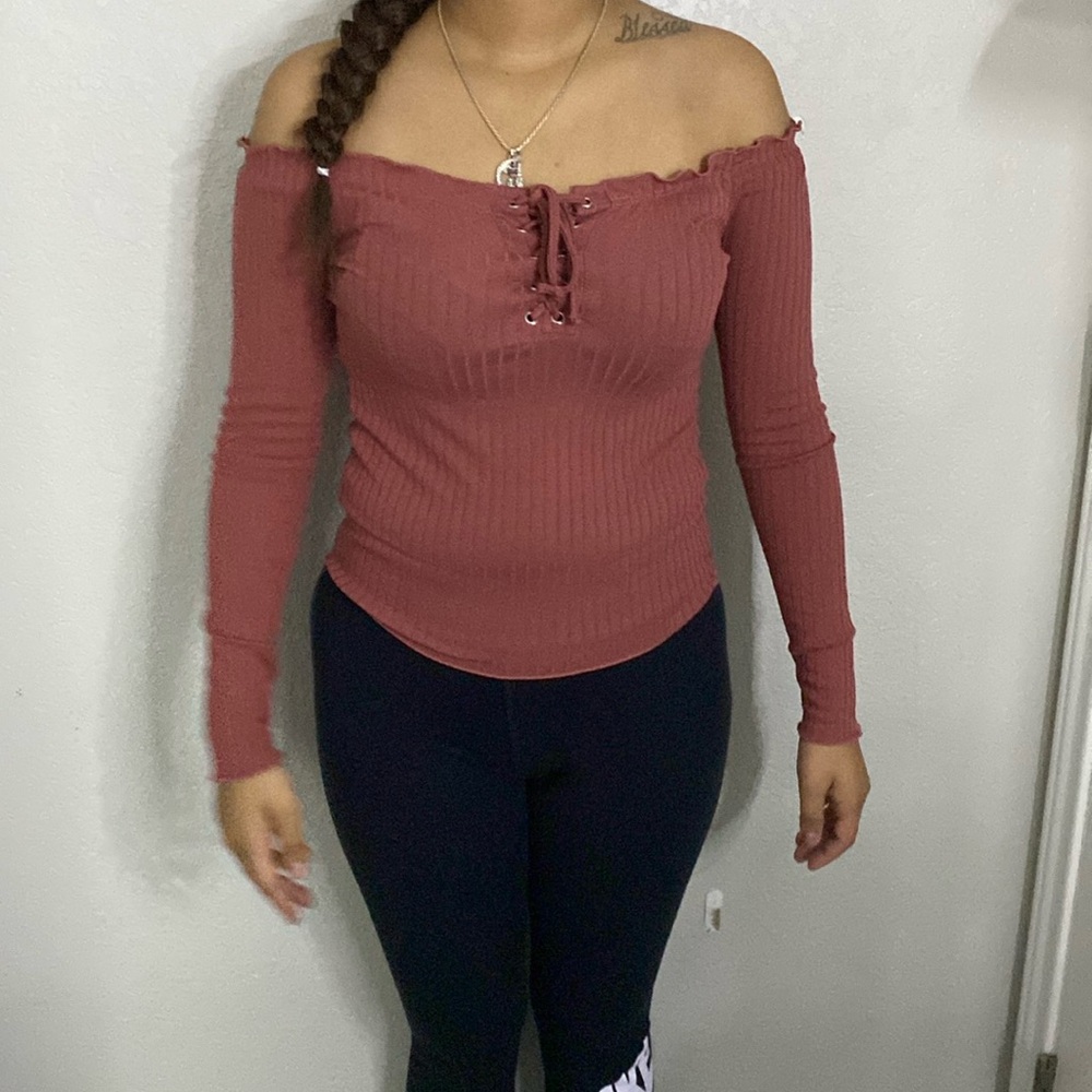 Pink shirt off the shoulder